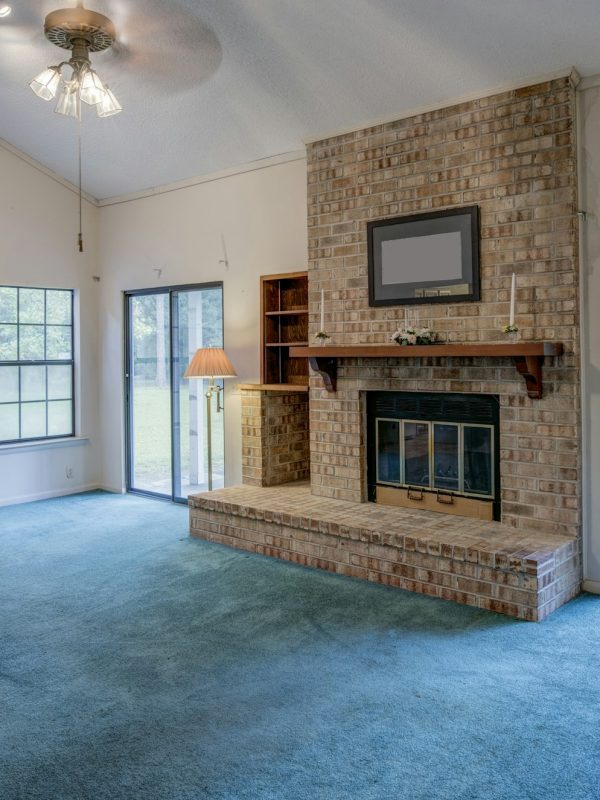 Simple living room in need of remodel.